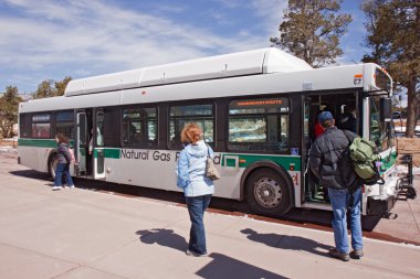 Boarding the shuttle bus at Grand Canyon Visitor's center clipart