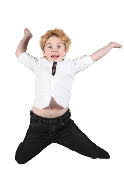 Bonito menino pulando no ar no fundo branco — Fotografia de Stock