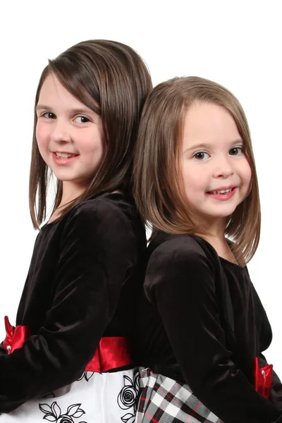 Urocze małe siostry na białym tle — Zdjęcie stockowe