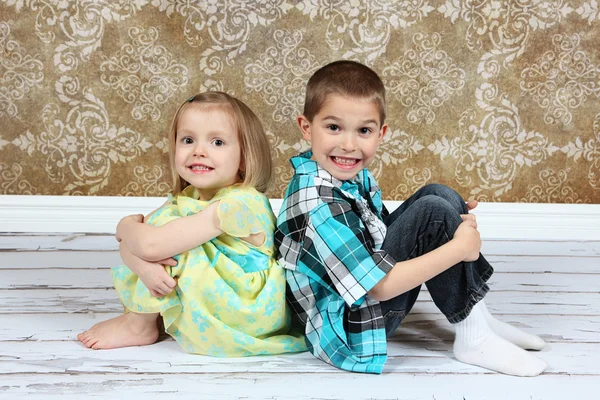 Adorable little brother and Sister on studio background — Stock Photo, Image