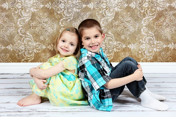 Adorable little brother and Sister on studio background — Stock Photo, Image