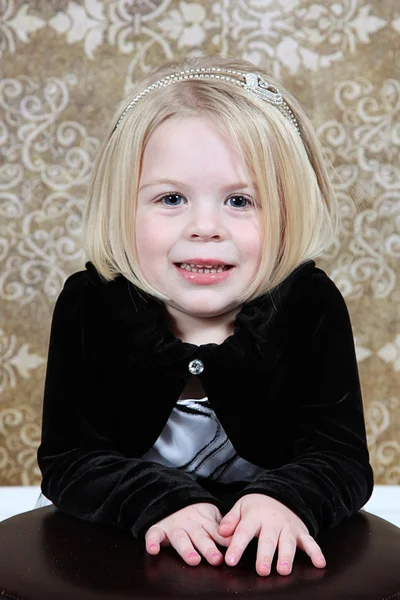 Cute little girl in studio posing for the camera — Stock Photo, Image