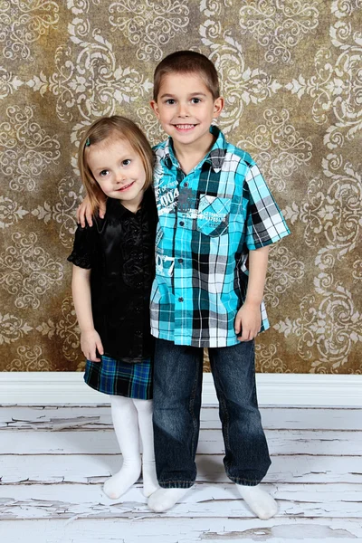 Adorable little brother and Sister on studio background Stock Image