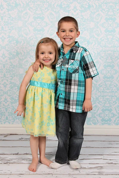 Adorable little brother and Sister on studio background Stock Image