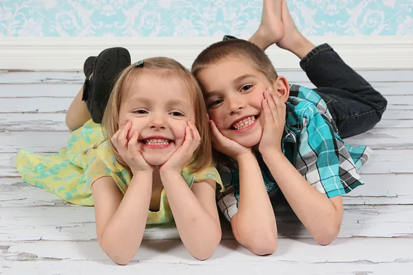 Adorable little brother and Sister on studio background Stock Picture