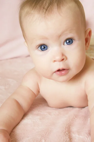 Baby In Crib on Belly — Stock Photo, Image