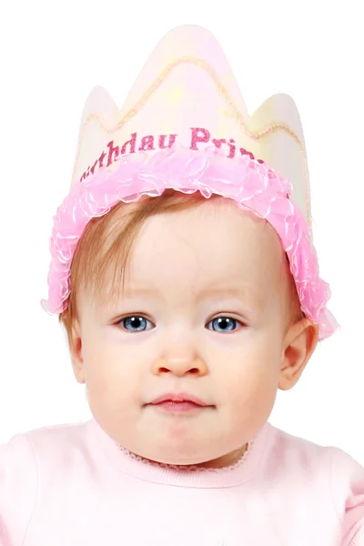 Bebé con sombrero de cumpleaños y la mano en el aire —  Fotos de Stock