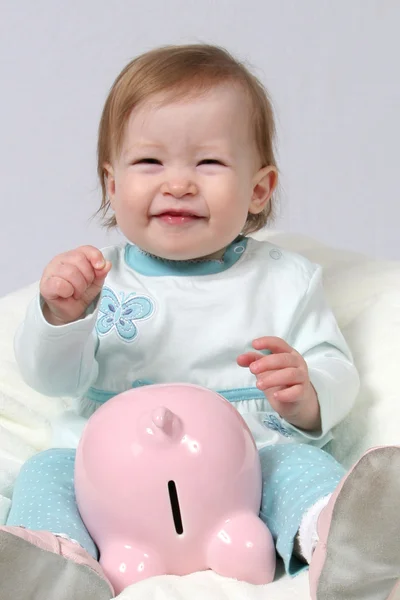 stock image Child Holding Piggy Bank