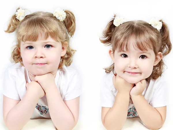 Adorable little sisters isolated on white background — Stock Photo, Image
