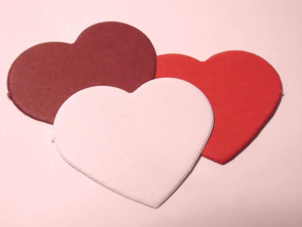 Tři srdce v červené barvě — Stock fotografie