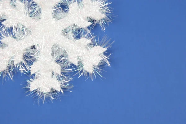 White Snowflake on blue background — Stock Photo, Image