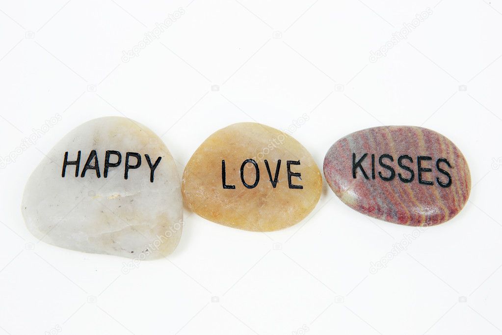 Happy, Love and Kisses engraved on stone