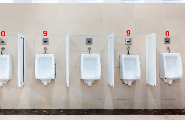 stock image Modern restroom interior with urinal row