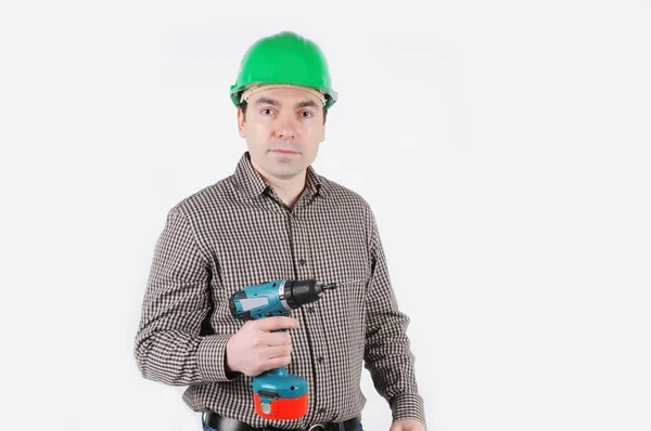 A man with drill in hand — Stock Photo, Image