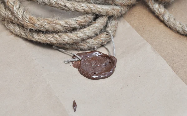 Ship ropes and old paper with a wax seal — Stock Photo, Image