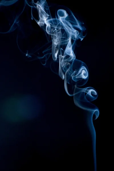 stock image Blue smoke on the black