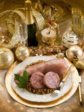 Pig trotter with lentils over golden christmas table clipart