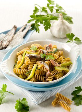 Fusilli with anchovies and zucchinis clipart