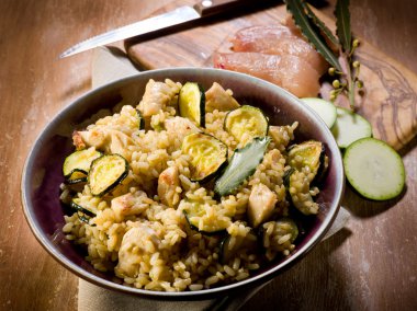 Risotto with chicken chest and zucchinis clipart