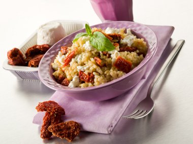 Brown rice with ricotta and dried tomatoes clipart