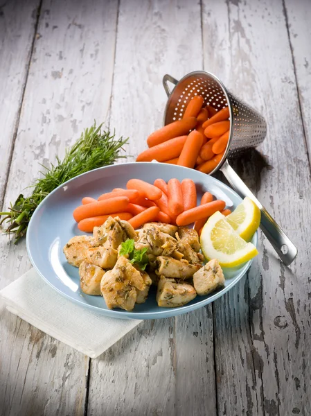 Chicken stew with herbs and small carrots — Stock Photo, Image