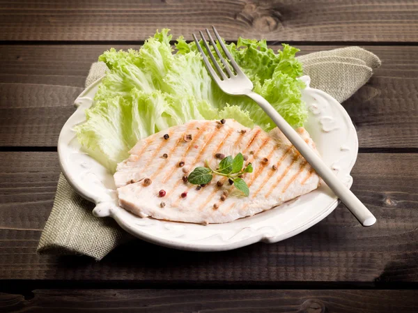 Healthy food chest of grilled chicken and lettuce