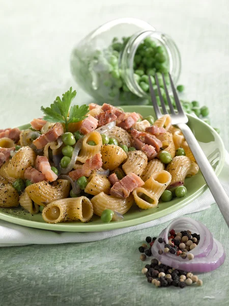 Pasta with peas bacon and parsley — Stock Photo, Image