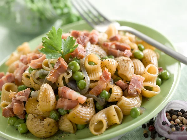 Stock image Pasta with peas bacon and parsley