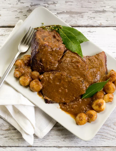 stock image Braised meat with onions