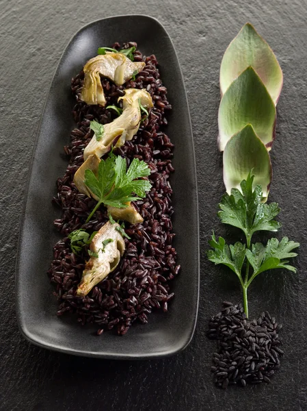 stock image Risotto with black rice and artichoke