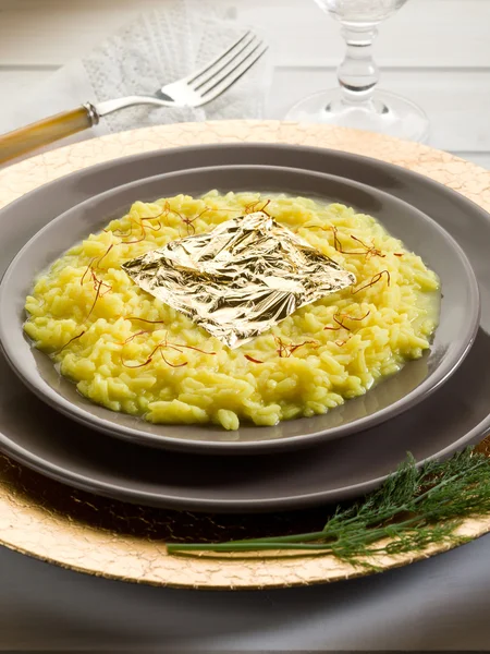 Saffron risotto with gold leaf (Gualtiero Marchesi's recipe) — Stock Photo, Image
