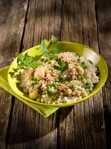 Barley risotto with sepia and beans — Stock Photo, Image