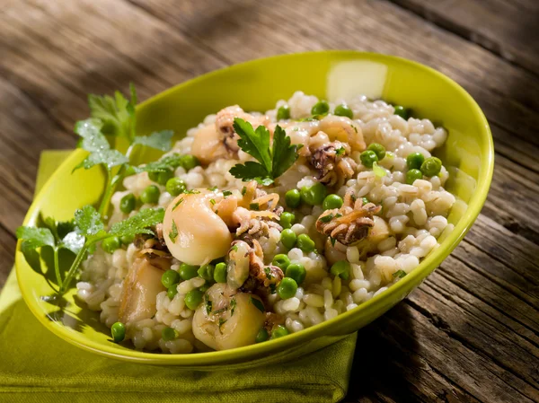 Barley risotto with sepia and beans — Stock Photo, Image