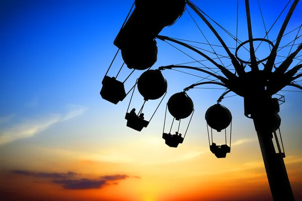 Amusement park at sunset — Stock Photo, Image