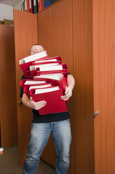 Man carrying the binders — Stock Photo, Image