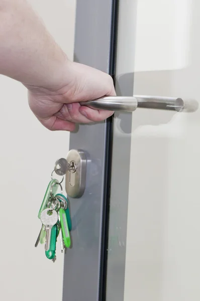 Human hand on the door handle — Stock Photo, Image