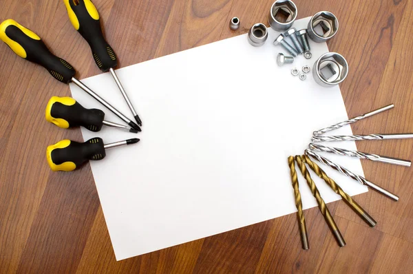 stock image Piece of paper and tools on its edge