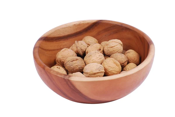 stock image Wooden plate with walnuts