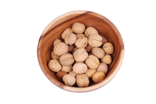 stock image Wooden plate with walnuts