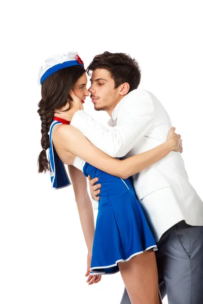 Elegant man kissing sailor woman. — Stock Photo, Image