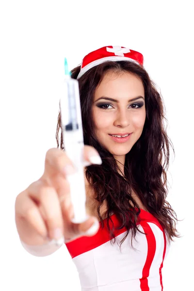 Sexy jovem enfermeira segurando uma seringa — Fotografia de Stock