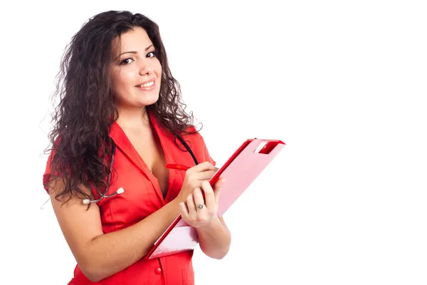 Счастливая медсестра или женщина врач, пишущая на планшете — стоковое фото