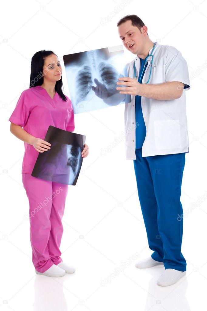 Two happy doctors interpreting a radiography