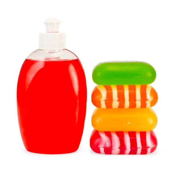Rode vloeibare zeep en stapelen solid zeep — Stockfoto