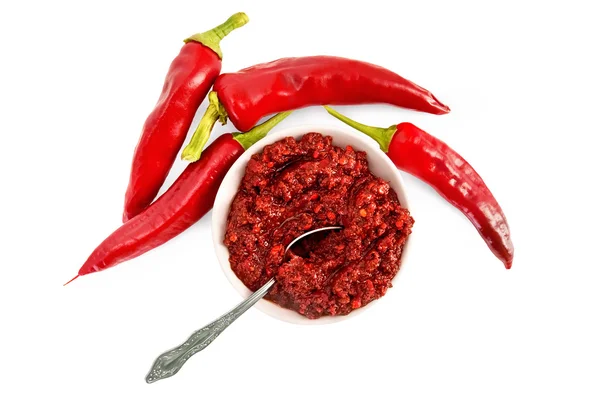 Adjika in a white cup with hot pepper — Stock Photo, Image