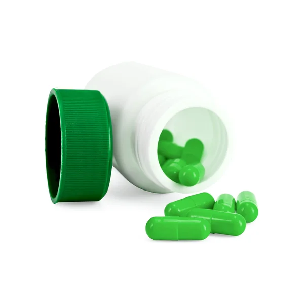 Cápsulas verde em garrafa — Fotografia de Stock