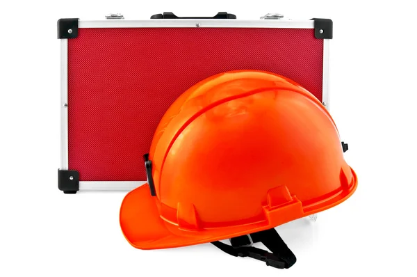 Orange helmet and red suitcase — Stock Photo, Image