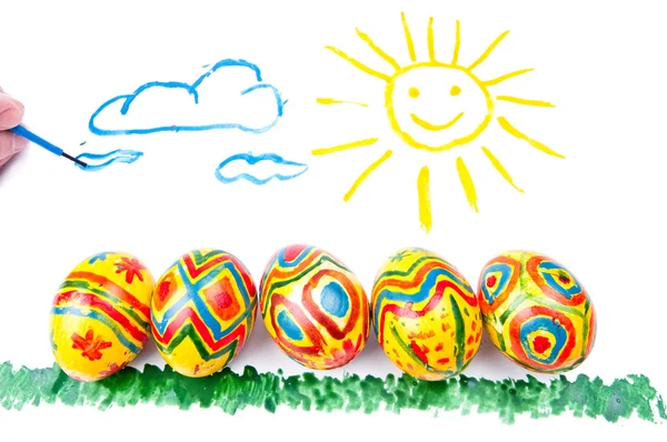 Photo de l'enfant par aquarelle : cinq œufs de Pâques sur une herbe , — Photo