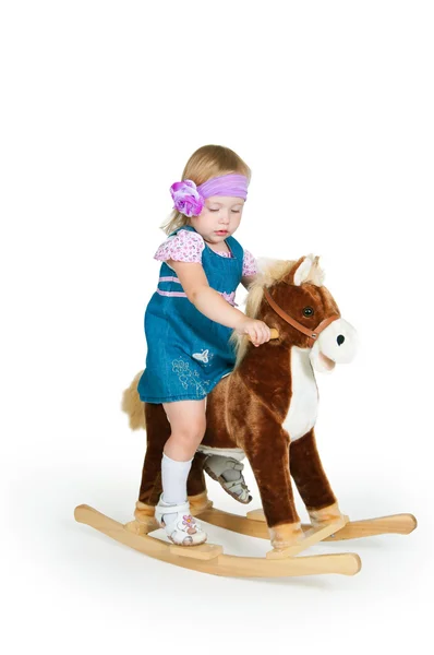 Baby und Spielzeug Pferd isoliert auf weiß — Stockfoto