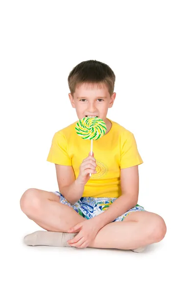 Child licking a lollipop — Stock Photo, Image